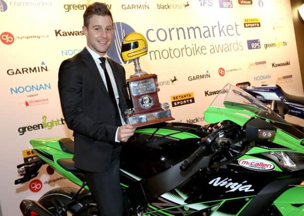Irish Motorcyclist of the Year winner Jonathan Rea celebrates with the Joey Dunlop Trophy.