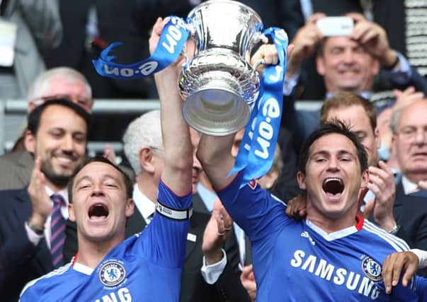 John Terry (left) and Frank Lampard (right) celebrate with the FA Cup Trophy in 2010