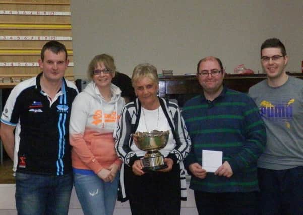 Marjorie Hamiliton, Secretary of 1st Donegore Bowling Club, presenting Andrew Morrison's Rink from 1st Ahoghill with the McConnell Rose Bowl after winning the 1st Donegore Pres. Annual Tournament  on Friday 8th January.