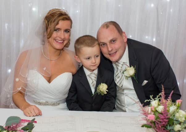 David Smith with his wife Katy on their wedding day, and their four-year-old son Danny