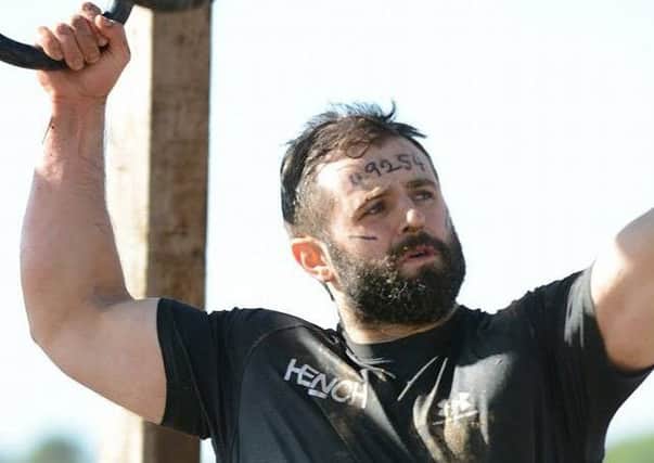 Rory Girvan competing in the Tough Mudder event