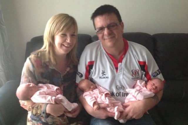 Gordon Adger and his wife Natasha proudly holding their beautiful triplets,  Freya Lucille, Remy Kathryn and Brynn Sarah. . (Submitted Picture).