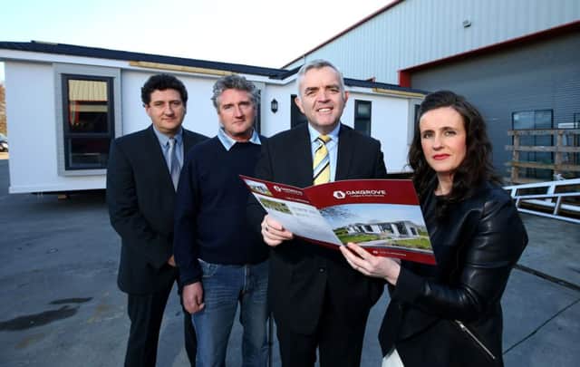 Enterprise Minister Jonathan Bell pictured with, from left, Kevin Eamonn and Bridin Flanagan