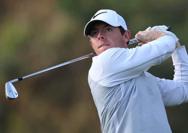 Rory McIlroy follows his ball on the 11th hole during first round of the Omega Dubai Desert Classic.