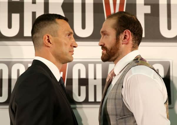 Wladimir Klitschko (left) and Tyson Fury during a press conference ahead of their world title fight last year.