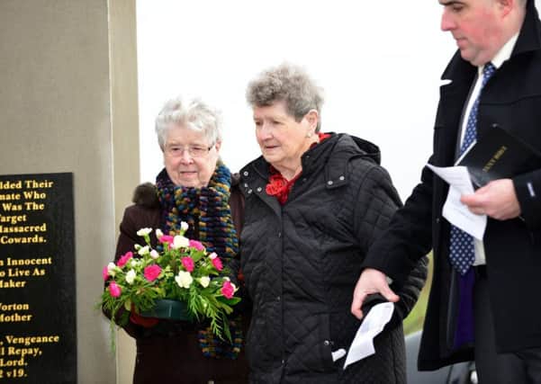 May Quinn and Beatrice Worton at the Kingsmills Memorial Wall.