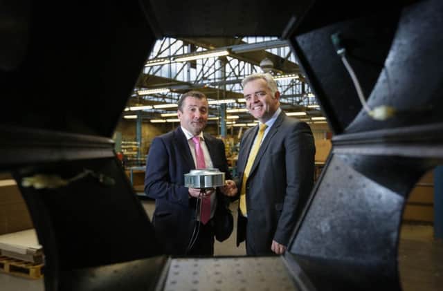 Enterprise Minister Jonathan Bell pictured with Brookvent managing director Declan Gormley