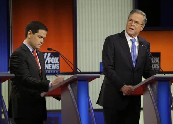 Marco Rubio, left, and Jeb Bush (AP Photo/Chris Carlson)