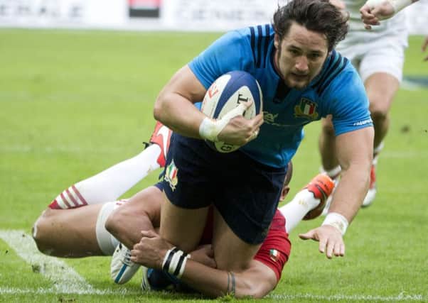 Italy's Luke Joseph McLean scores a try caught by France's Rabah Slimani