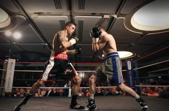 .

James Fryers in action against Maxi Hughes at the Europa Hotel in Belfast on Saturday night