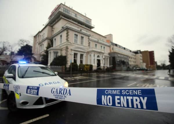 File photo dated 05/02/16 of a Garda cordon outside the Regency Hotel in Dublin, as a major investigation was underway today after gunmen dressed up in police uniforms opened fire in the Irish hotel lobby, killing one man and seriously injuring two others