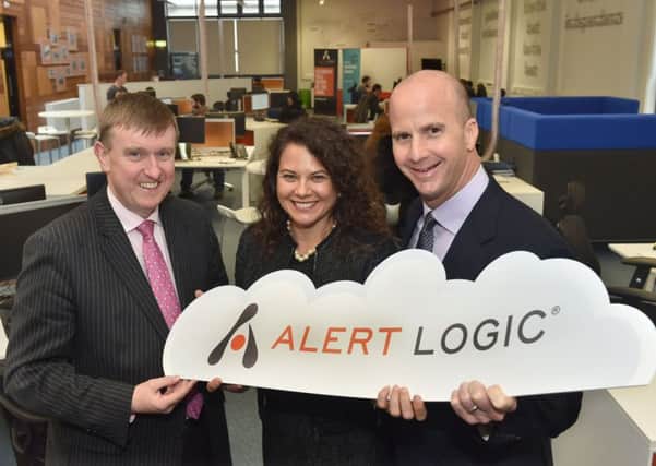 Finance Minister Mervyn Storey with Kimberley Bowron, SVP of Talent Management, and Alert Logic CEO Gray Hall