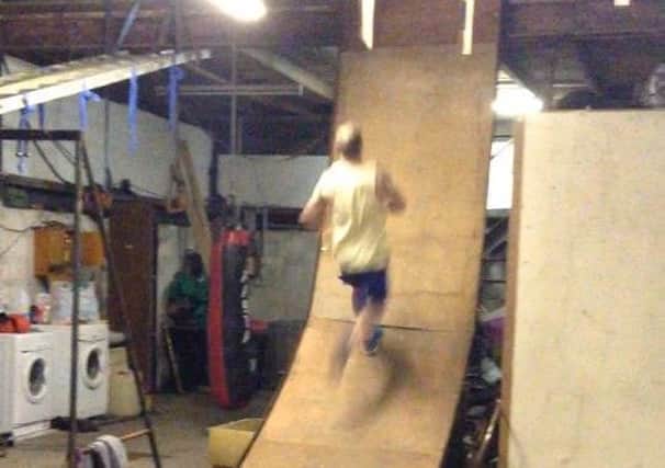 Gary Weir practicing on the warped wall he built himself