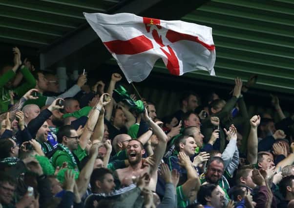 Northern Ireland fans celebrate after the win over Greece - but there is much anger now about tickets.