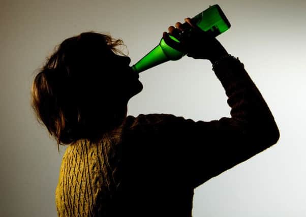 PICTURE POSED BY MODEL 
 of someone drinking alcohol