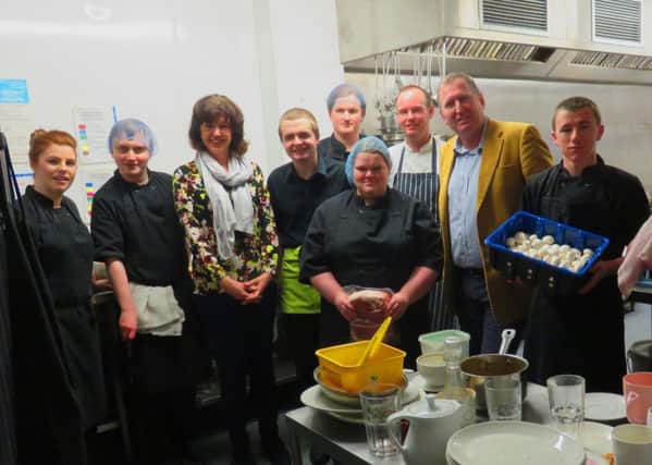 Fiona Rowan, third left, and Councillor Doug Beattie, second right, with chefs and trainees in the kitchen of The 180 Degrees Restaurant in Portadown
