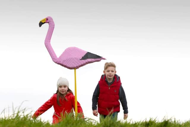 Oliva Rose (7) and Watson Kingham (8) pictured along with Flavia the flamingo, the LEGO brick animal at WWT Castle Espie Wetland Centre, Comber.