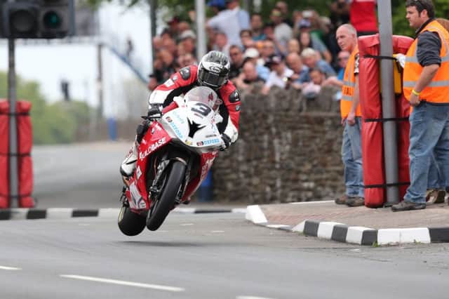 Pacemaker Press, Belfast: 12/06/2015: Michael Dunlop on the Buildbase BMW at St Ninian's during the Pokerstars Senior TT race. PICTURE BY DAVE KNEEN