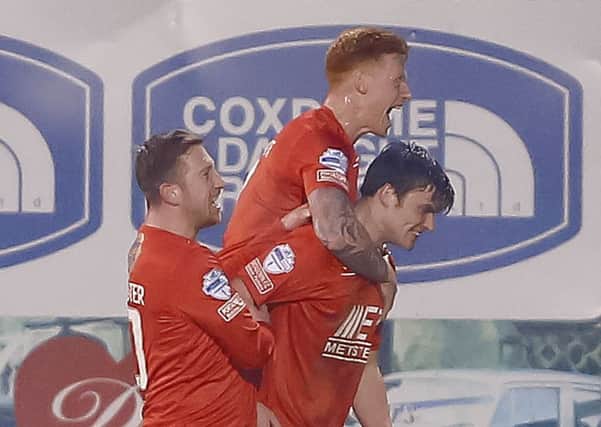 Celebration time for Portadown following Philip Lowry's (right) goal in the 2-1 victory over Linfield. Pic by PressEye Ltd.