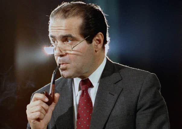 In this Aug. 6, 1986 file photo, Supreme Court Justice nominee Anthony Scalia attends a Senate Judiciary Committee during his confirmation hearings in Washington. (AP Photo/Lana Harris)