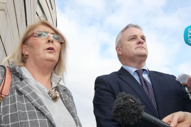 Arlene Arkinson's sister Kathleen arrives at the courts in Belfast with her solicitor Des Doherty for the beginning of the inquest which has been delayed for nine years