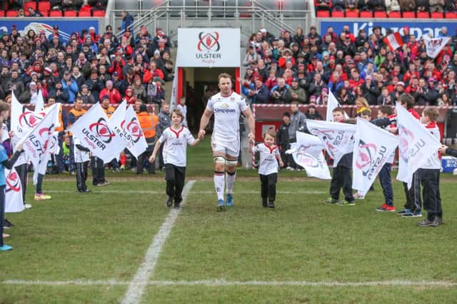 Roger Wilson leads Ulster out to win his 200th cap during the Guinness Pro12 clash against Scarlets at Kingspan Stadium