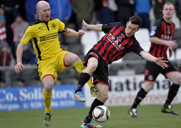 Paul Heatley (right) and Ryan Catney do battle