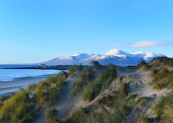 Tyrella beach, Downpatrick, County Down with the snow topped Mountains of Mourne in the distance