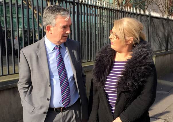 Colin Murray, a former detective in Kent Police speaks with with Kathleen Arkinson, sister of Arlene Arkinson, outside Laganside Court complex in Belfast