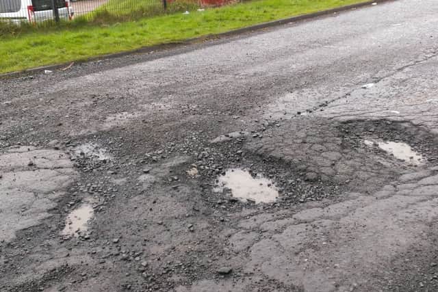 The large potholes outside Larne MOT centre. INLT-08-706-con