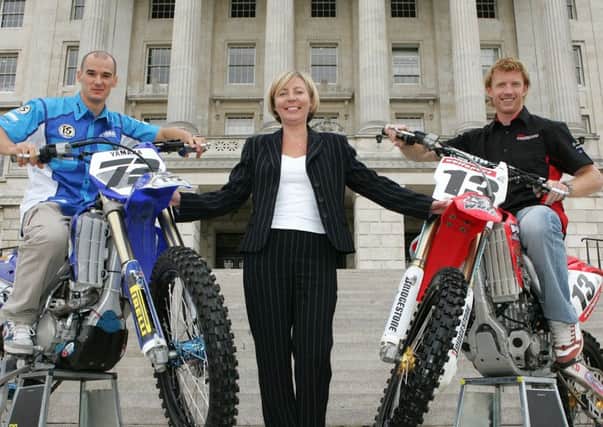 Janice McAleese, former chief executive of the Northern Ireland Events Company, promoting a motocrosss event  with riders Stefan Everts (left) and Gordon Crockard