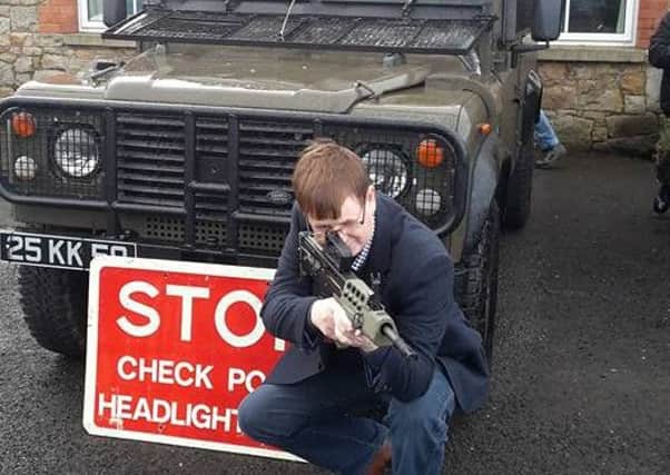 Willie Frazer posing with a SA-80 at an exhibition. Taken from his Facebook