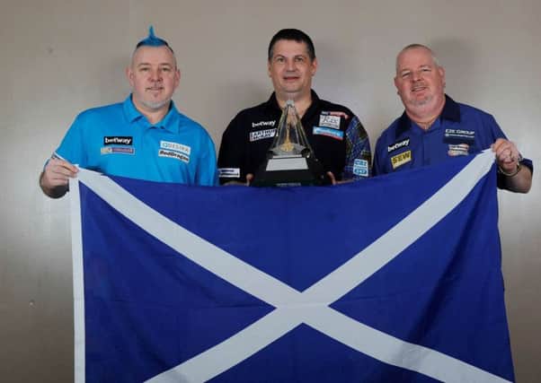Scottish trio Peter Wright, Gary Anderson and Robert Thornton, plus an image of Michael van Gerwen. Pic by Lawrence Lustig/PDC.
