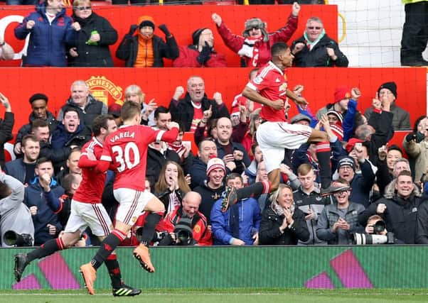 Manchester United's Marcus Rashford (centre) celebrates scoring against Arsenal