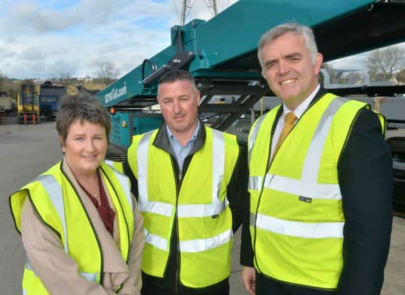 Pictured with Enterprise Minister Jonathan Bell are directors Seamus and Alison McGrath
