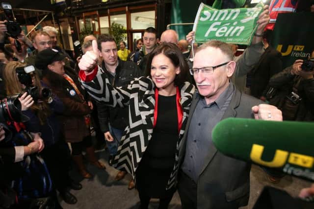 Sinn Fein candidate for Dublin Central Mary Lou McDonald arrives with Sinn Fein candidate Dessie Ellis at the election count centre at the RDS in Dublin, Ireland, as the general election 2016 count gets underway. Photo: Brian Lawless/PA Wire