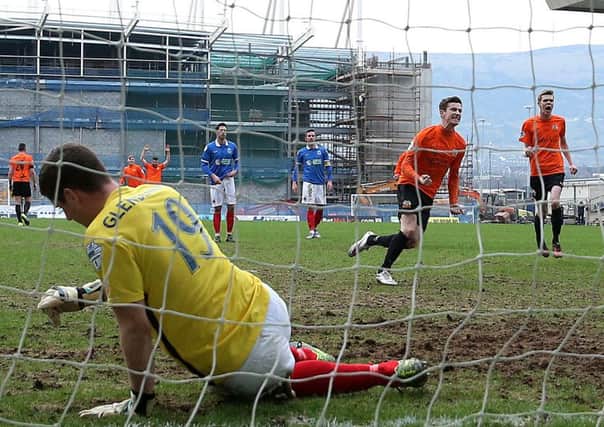 Andy McGrory scores his equalising penalty