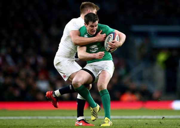 England's Owen Farrell tackles Ireland's Jonathan Sexton