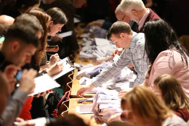 Ballot papers are verified as the general election 2016 count gets underway for Cork at the City Hall in Cork, Ireland. Photo: Chris Radburn/PA Wire