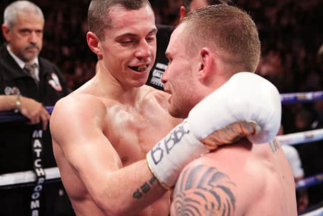 Scott Quigg (left) and Carl Frampton embrace after their IBF & WBA World Super-Bantamweight Championship bout at Manchester Arena