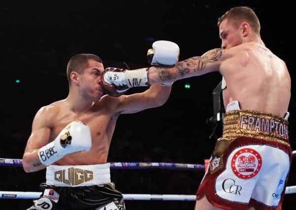 Carl Frampton (right) and Scott Quigg during their IBF & WBA World Super-Bantamweight Championship bout at Manchester Arena