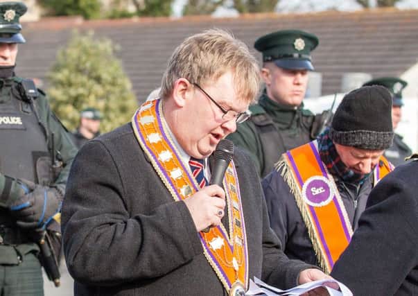 Harold Henning addresses Orangemen and supporters at the weekly Woodvale Road protest in support of the Ligoniel lodges