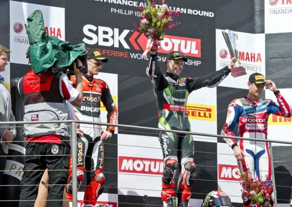 Jonathan Rea celebrates victory in race one at Phillip Island.