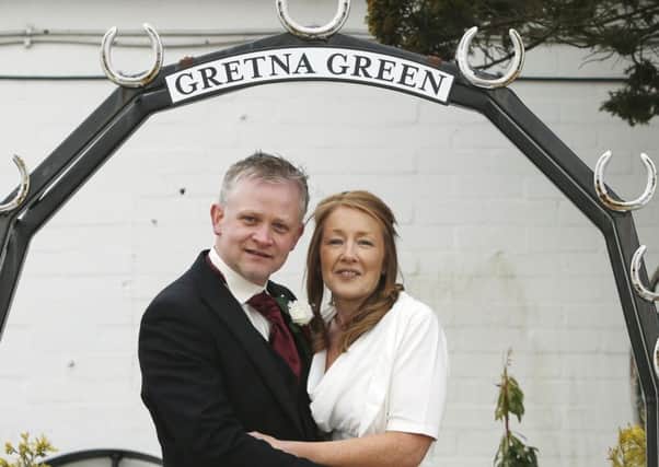 Neil Hutchison with wife Heather after their wedding at Gretna Green in Scotland