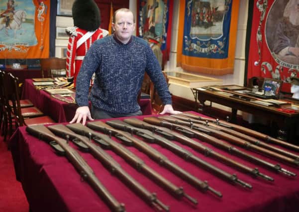 Orangeman Ronnie McDowell with some of the weapons discovered