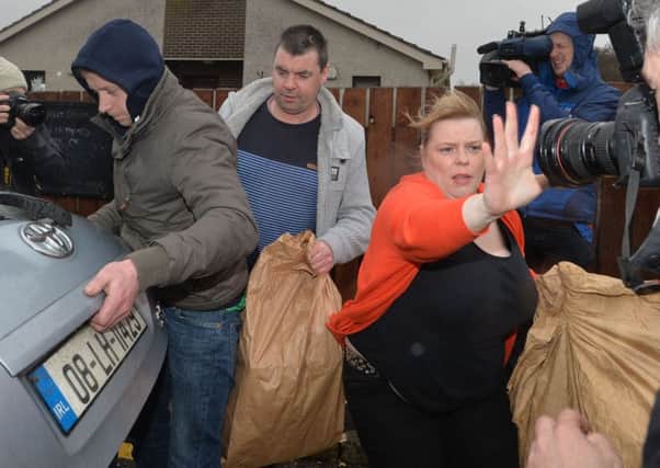 Family members help Seamus Daly into a car outside Maghaberry Prison