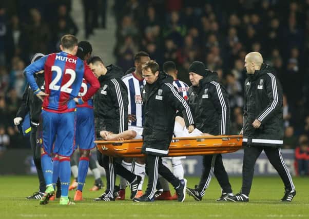 Northern Ireland's Chris Brunt is stretchered off during West Brom's Barclays Premier League match against Crystal Palace.
