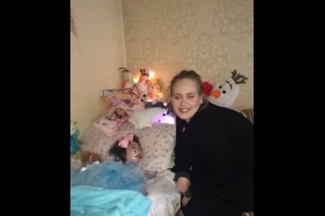 Handout photo taken with permission from the Twitter feed of @tracygibney of Adele meeting 12-year-old Rebecca Gibney at her home in Belfast, as the singer made the young fan's dreams come true when she paid a visit to her bedside