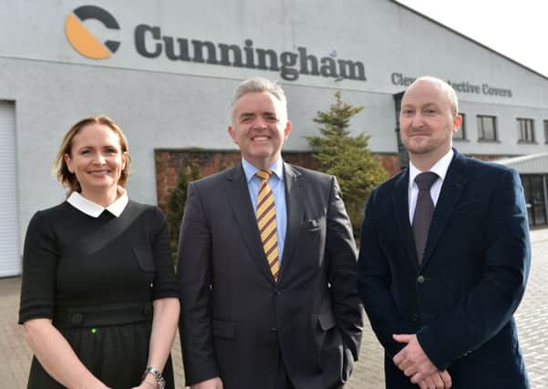 Enterprise Minister Jonathan Bell pictured at Cunningham Covers with  David Cunningham and Briege Cunningham