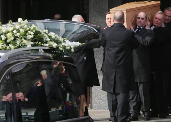 Pallbearers carry the coffin of the late actor Frank Kelly, best known for his role as Father Jack in the hit comedy television series Father Ted